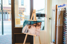 Load image into Gallery viewer, Tarpon metal print in a fly shop.